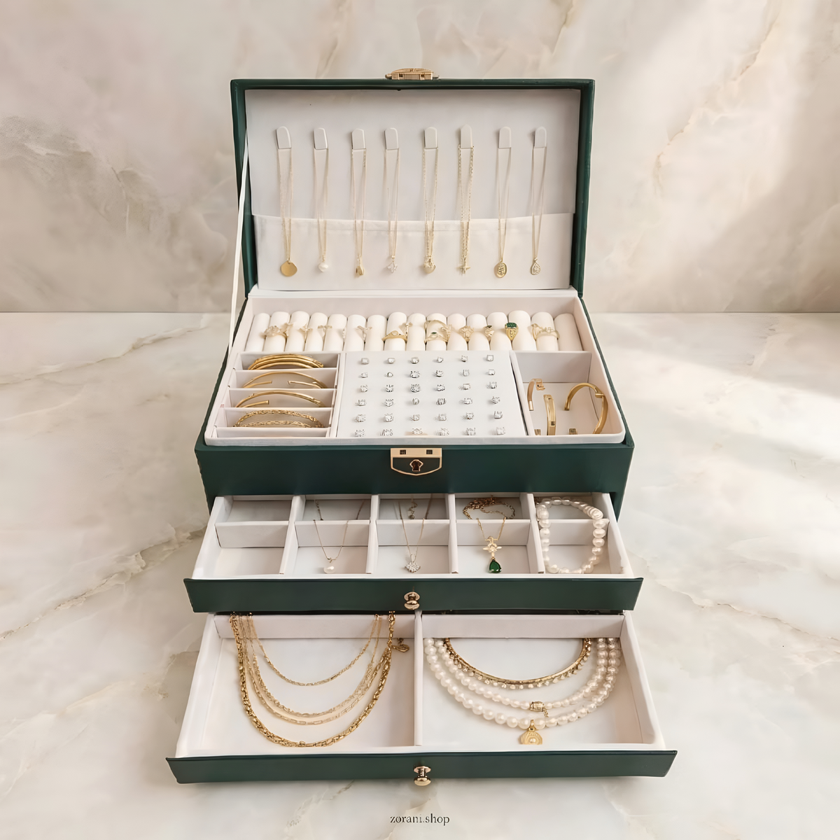 Inside of ZORANI Emerald Jewelry Organizer showing rings necklaces and earrings storage - 100+ capacity