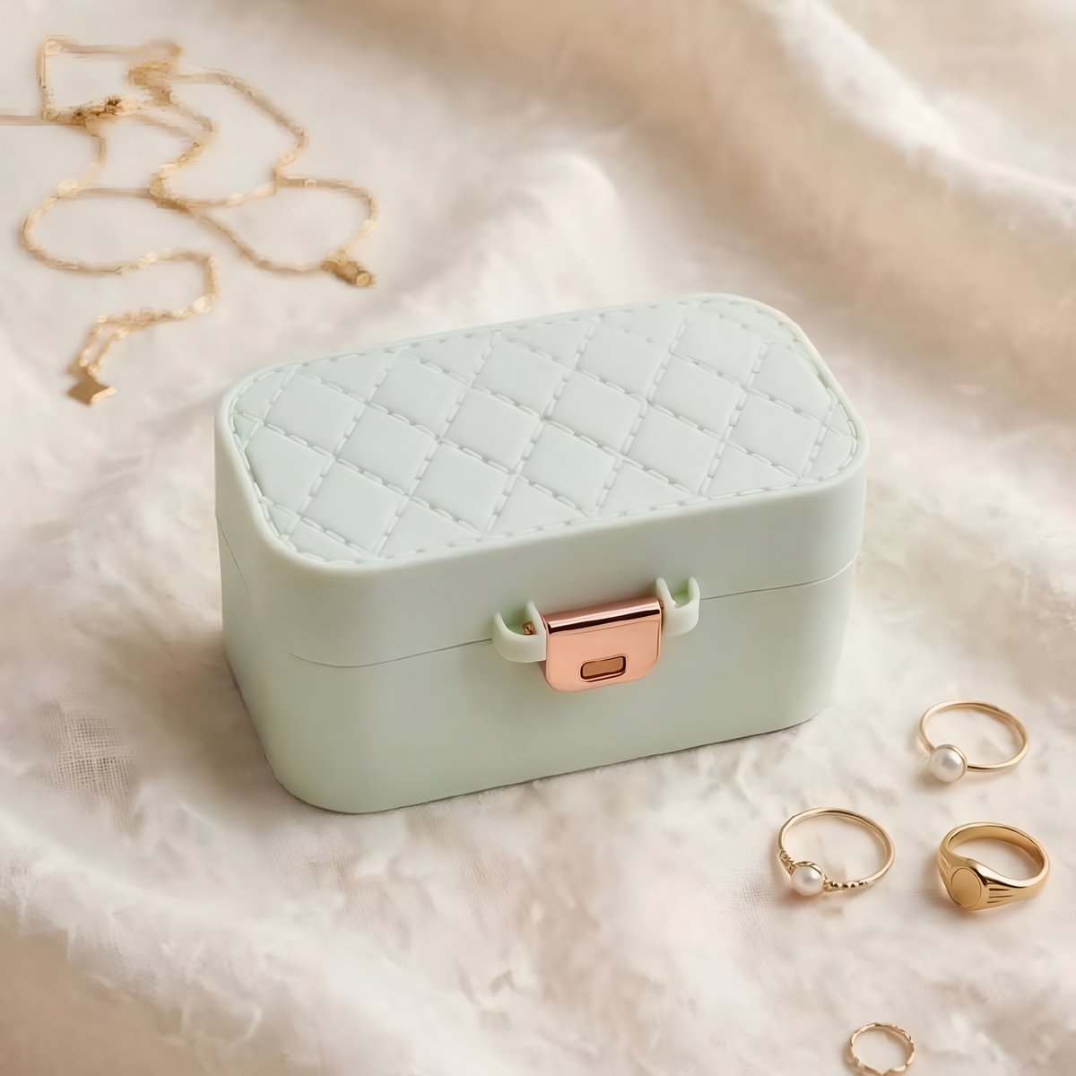 "ZORANI Mint Green Quilted Mini Travel Jewelry Box with Rose Gold Clasp on linen fabric"