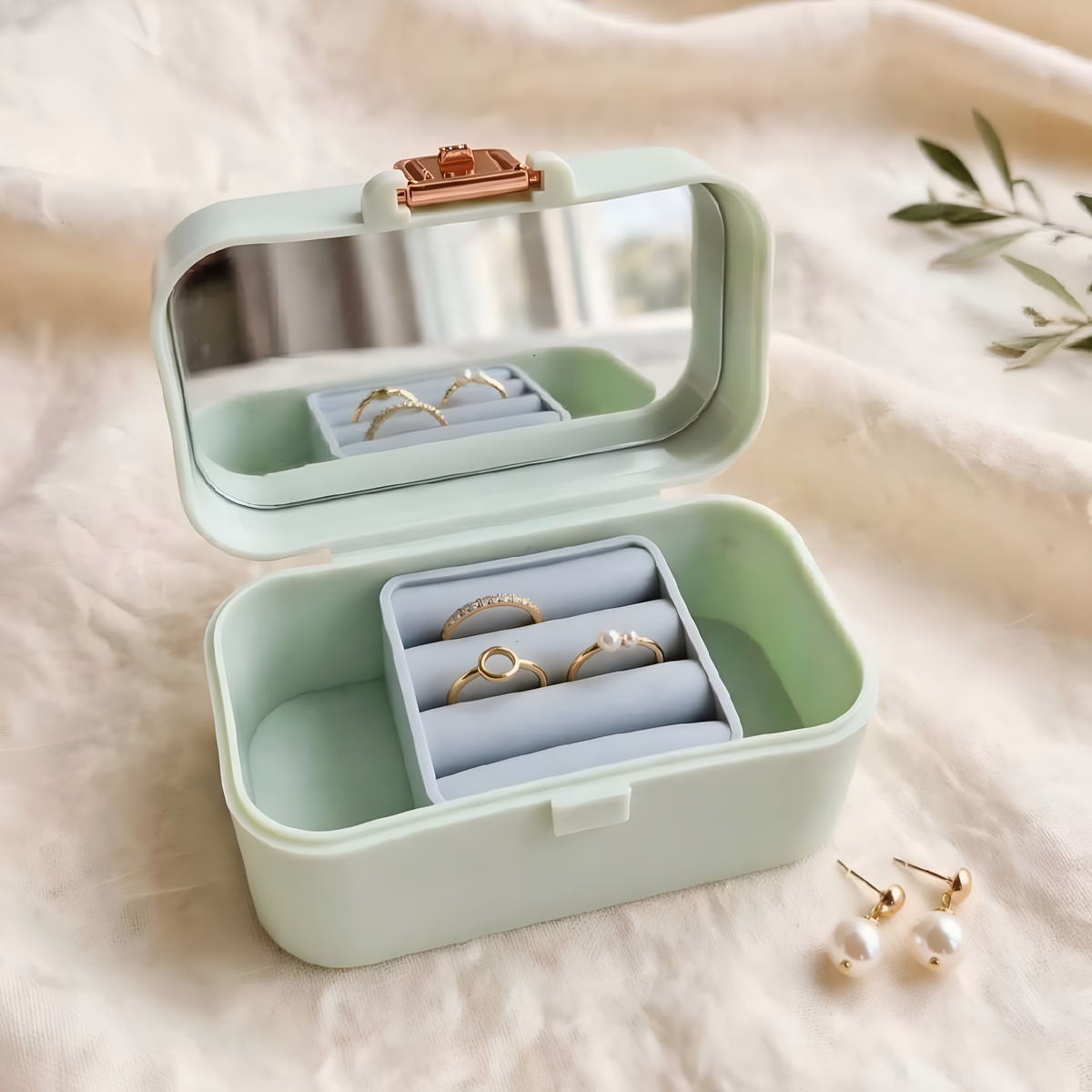 "ZORANI jewelry box open showing mirror and ring holder with pearl earrings"